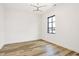 Spacious bedroom with hardwood floors and a large window at 527 E North St, Indianapolis, IN 46204