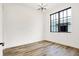 Bright bedroom with hardwood floors and large window at 527 E North St, Indianapolis, IN 46204