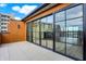 Private rooftop deck with sliding glass doors leading to interior at 527 E North St, Indianapolis, IN 46204