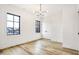 Bedroom with hardwood floors, large windows and chandelier at 531 E North St, Indianapolis, IN 46204