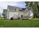 Rear view of house, showcasing deck and grassy yard at 22133 State Road 37 N, Noblesville, IN 46060
