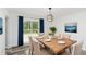 Dining room with wooden table and access to deck at 22133 State Road 37 N, Noblesville, IN 46060