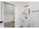 Clean bathroom with white vanity, round mirror, and black accents at 22133 State Road 37 N, Noblesville, IN 46060