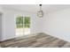 Bright dining room with sliding glass door leading to deck at 22133 State Road 37 N, Noblesville, IN 46060
