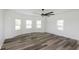 Spacious bedroom with hardwood floors and multiple windows at 22133 State Road 37 N, Noblesville, IN 46060