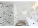 Spa-like bathroom with double vanity, marble shower, and gold accents at 22133 State Road 37 N, Noblesville, IN 46060
