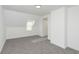 Bright bedroom with grey carpet, window, and ample closet space at 22133 State Road 37 N, Noblesville, IN 46060