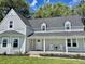 Newly renovated farmhouse with front porch and landscaping at 22133 State Road 37 N, Noblesville, IN 46060