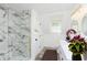 Elegant bathroom with marble shower, double vanity, and modern fixtures at 22133 State Road 37 N, Noblesville, IN 46060