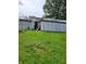 House exterior and detached garage undergoing renovations at 3025 S Keystone Ave, Indianapolis, IN 46237