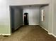 A living room with gray walls and brown carpet at 642 N Oxford St, Indianapolis, IN 46201