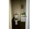 Small bathroom with white toilet and vanity at 642 N Oxford St, Indianapolis, IN 46201