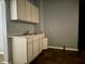 Small kitchen with white cabinets and a double sink at 642 N Oxford St, Indianapolis, IN 46201