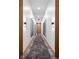 Clean and modern hallway with neutral color scheme at 877 N East St # 104, Indianapolis, IN 46202