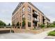 Multi-unit building with brick exterior, balconies, and underground parking at 877 N East St # 104, Indianapolis, IN 46202