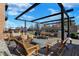 Outdoor kitchen with pergola, seating, and grill at 877 N East St # 104, Indianapolis, IN 46202