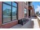 Patio with brick wall and modern outdoor seating at 877 N East St # 104, Indianapolis, IN 46202