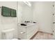 Double vanity with modern fixtures in this stylish bathroom at 877 N East St # 104, Indianapolis, IN 46202