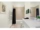 Bright bathroom, featuring a bathtub and double vanity at 877 N East St # 104, Indianapolis, IN 46202