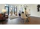 Open concept dining area with modern table and chairs near living room at 877 N East St # 104, Indianapolis, IN 46202