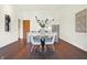 Modern dining area with dark hardwood floors and a round table at 877 N East St # 104, Indianapolis, IN 46202
