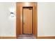 Modern entryway with a light wood door and sleek design at 877 N East St # 104, Indianapolis, IN 46202