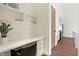 Built-in shelves and a white desk create a functional home office at 877 N East St # 104, Indianapolis, IN 46202