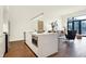 Open concept kitchen with island seating and dark hardwood floors at 877 N East St # 104, Indianapolis, IN 46202