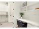 Bright laundry room with white cabinets and a workspace at 877 N East St # 104, Indianapolis, IN 46202