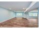 Finished basement with light blue walls and wood floors at 372 Foxboro Cir, Avon, IN 46123