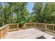 Wooden deck overlooking a wooded backyard at 372 Foxboro Cir, Avon, IN 46123