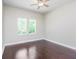 Spacious bedroom featuring dark hardwood floors and two windows at 372 Foxboro Cir, Avon, IN 46123