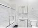 Clean bathroom with marble tile and white vanity at 372 Foxboro Cir, Avon, IN 46123