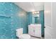 Basement bathroom with teal geometric wallpaper at 372 Foxboro Cir, Avon, IN 46123