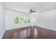 Spacious bedroom with dark hardwood floors and ceiling fan at 372 Foxboro Cir, Avon, IN 46123