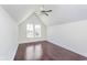Bright bedroom with dark hardwood floors and two windows at 372 Foxboro Cir, Avon, IN 46123
