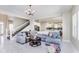 Open living room with sectional sofa and view of kitchen at 372 Foxboro Cir, Avon, IN 46123