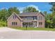 Brick two-story house with a large front yard at 372 Foxboro Cir, Avon, IN 46123