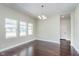 Bright dining room with hardwood floors and chandelier at 372 Foxboro Cir, Avon, IN 46123