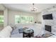 Cozy living room with fireplace and large windows at 372 Foxboro Cir, Avon, IN 46123