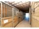 Interior view of a barn with multiple horse stalls at 9407 N Whitney Way, Monrovia, IN 46157