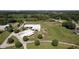 Aerial view of equestrian property with large barns and paddocks at 9407 N Whitney Way, Monrovia, IN 46157