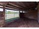 Empty horse stall with a gate opening to the paddock at 9407 N Whitney Way, Monrovia, IN 46157