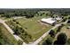 Aerial view of farm with paddocks and outbuildings at 9407 N Whitney Way, Monrovia, IN 46157