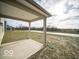 Covered patio with concrete flooring, overlooking a grassy backyard at 1305 Bert Rd, Danville, IN 46122