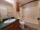Clean bathroom with tub shower and wood vanity at 1096 Bumblebee Way, Greenfield, IN 46140