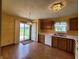 Kitchen with oak cabinets, a view to the backyard, and a breakfast nook at 1096 Bumblebee Way, Greenfield, IN 46140