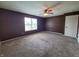 Spacious bedroom with ceiling fan and large window at 1096 Bumblebee Way, Greenfield, IN 46140