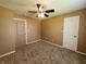 Simple bedroom with ceiling fan and neutral walls at 1096 Bumblebee Way, Greenfield, IN 46140