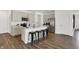 Modern kitchen with light cabinets, stainless steel appliances and an island at 3422 Wetherby Pl, Danville, IN 46122